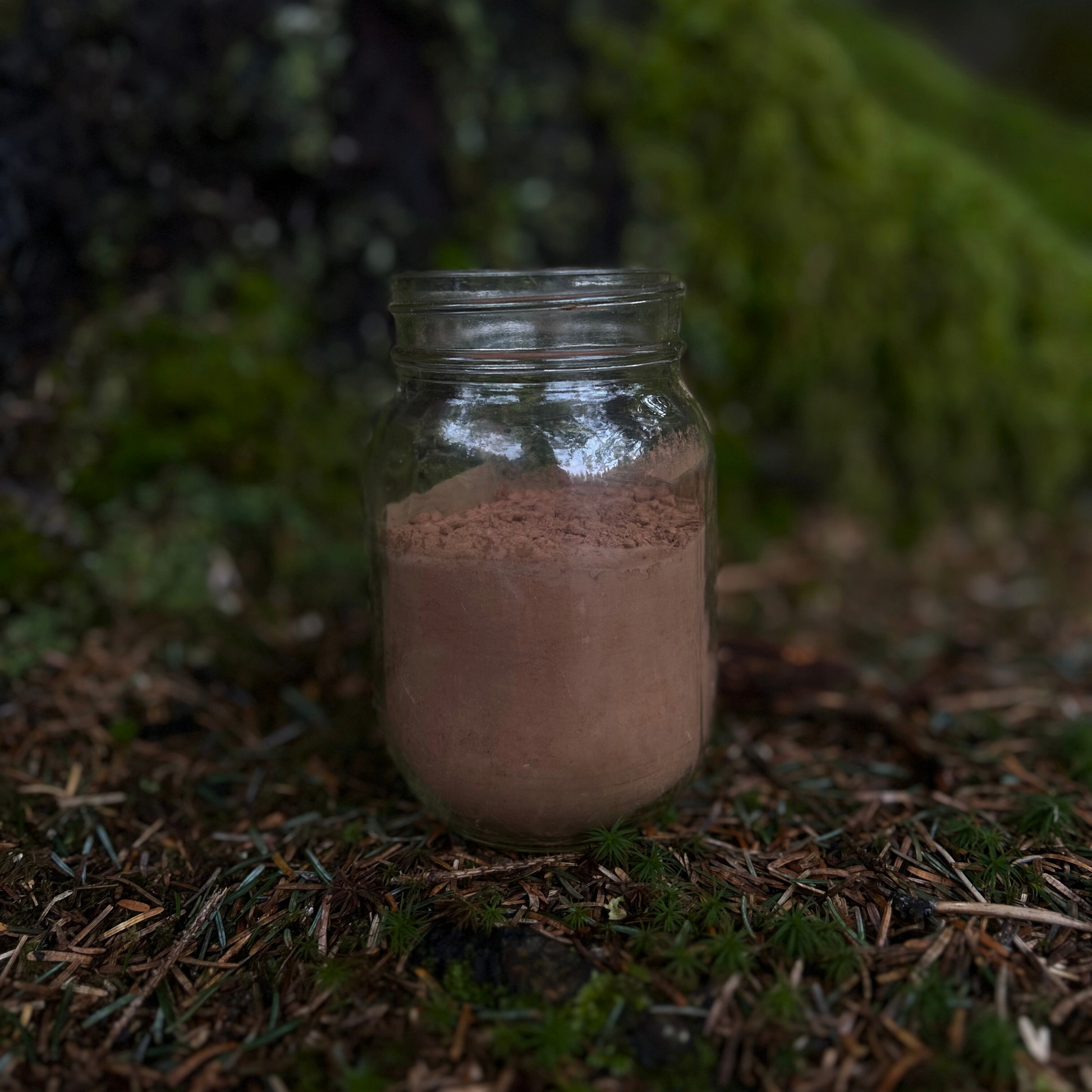 A steaming mug of chocolate lavender cocoa with a sprinkle of dried lavender, perfect for winding down after a long day.